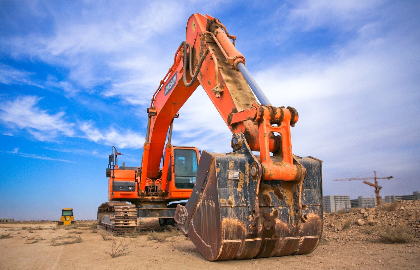 Excavator used for concrete site preparation and grading near Terrell Texas