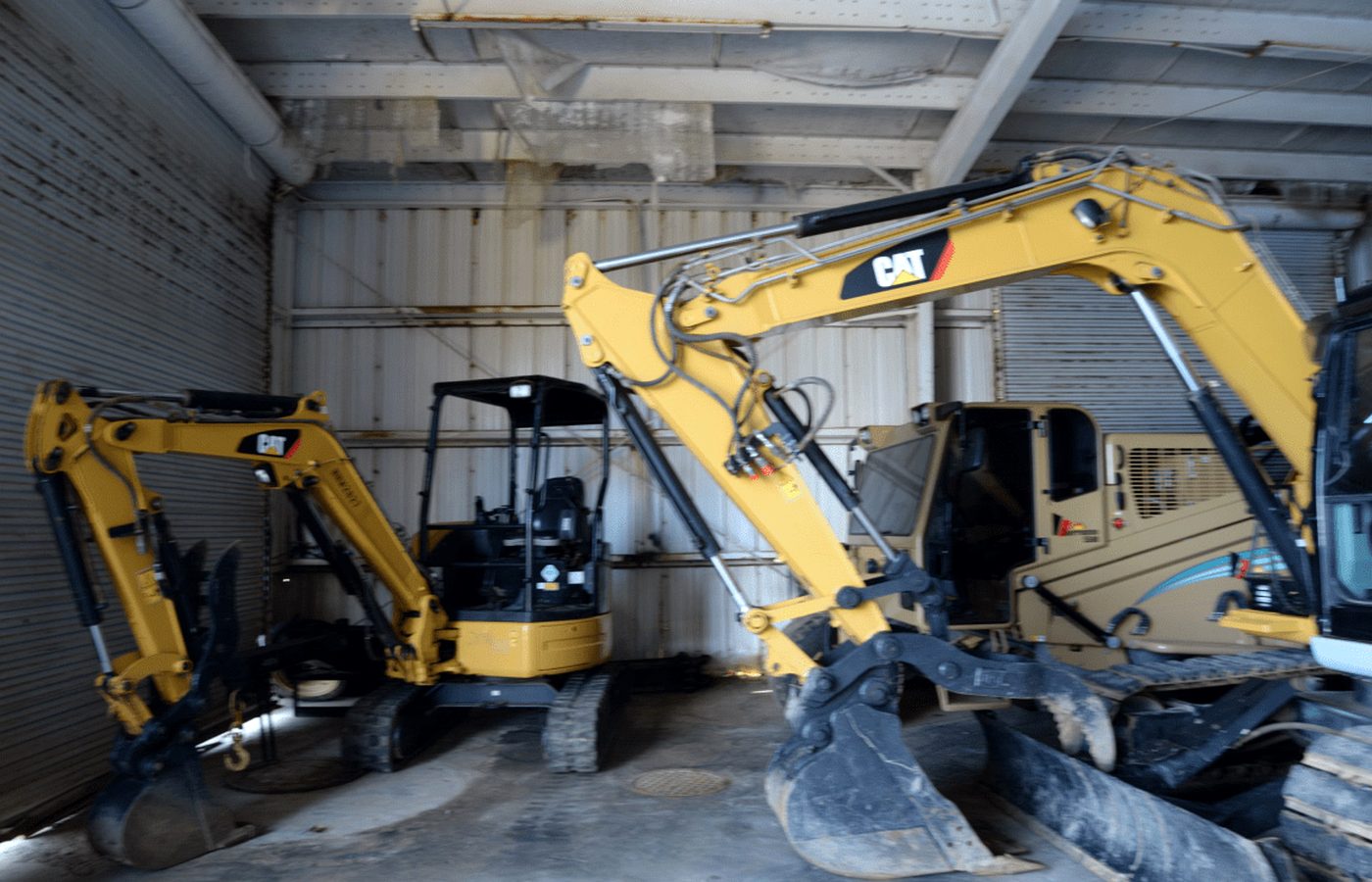 Excavators staged for industrial concrete and site preparation